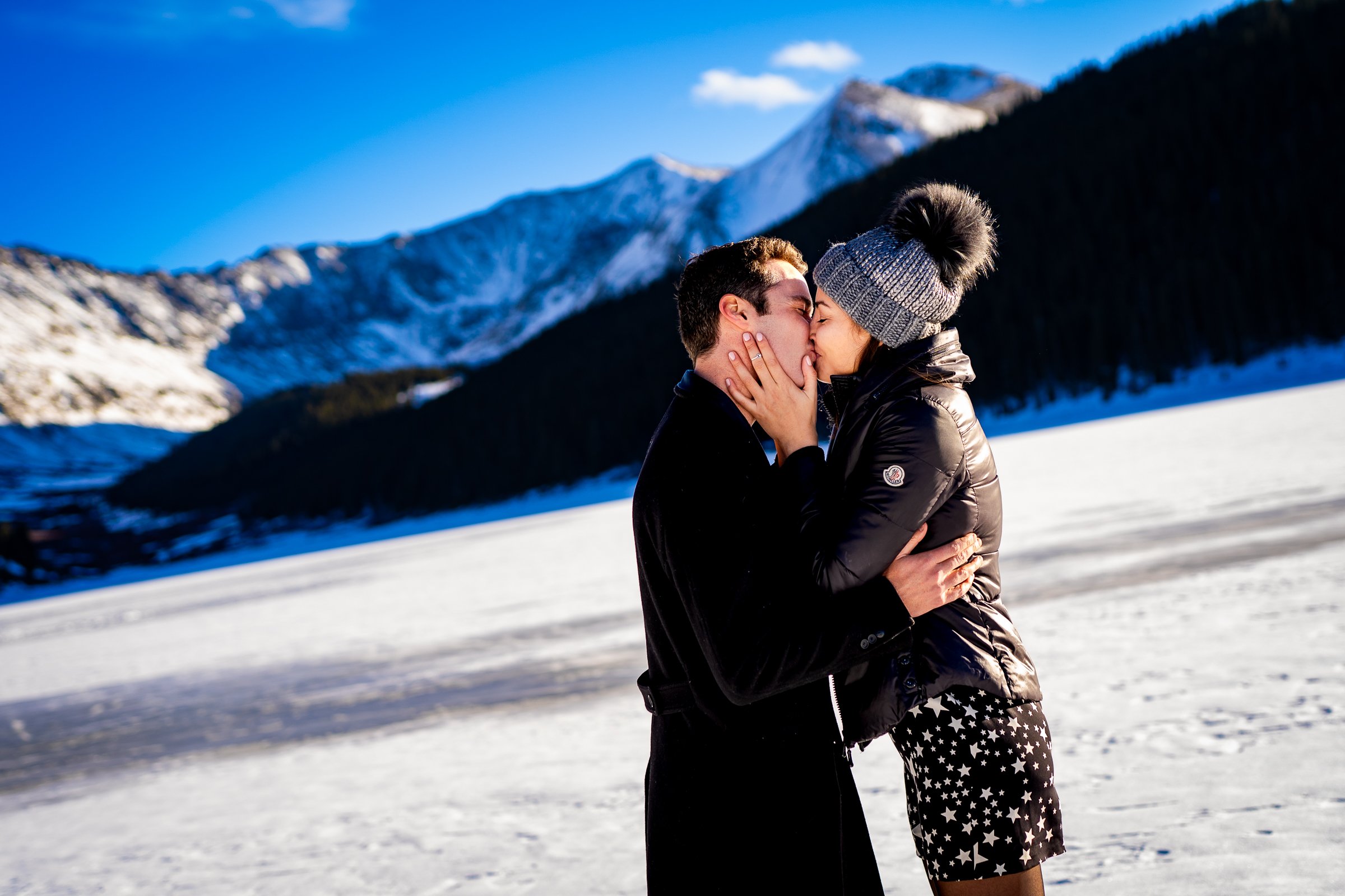 Man proposes to girlfriend while standing on a frozen lake with snowcapped mountains in the background, Engagement Session, Engagement Photos, Engagement Photos Inspiration, Engagement Photography, Engagement Photographer, Winter Engagement Photos, Proposal Photos, Proposal Photographer, Proposal Photography, Winter Proposal, Mountain Proposal, Proposal Inspiration, Summit County engagement session, Summit County engagement photos, Summit County engagement photography, Summit County engagement photographer, Summit County engagement inspiration, Colorado engagement session, Colorado engagement photos, Colorado engagement photography, Colorado engagement photographer, Colorado engagement inspiration, Clinton Gulch Engagement