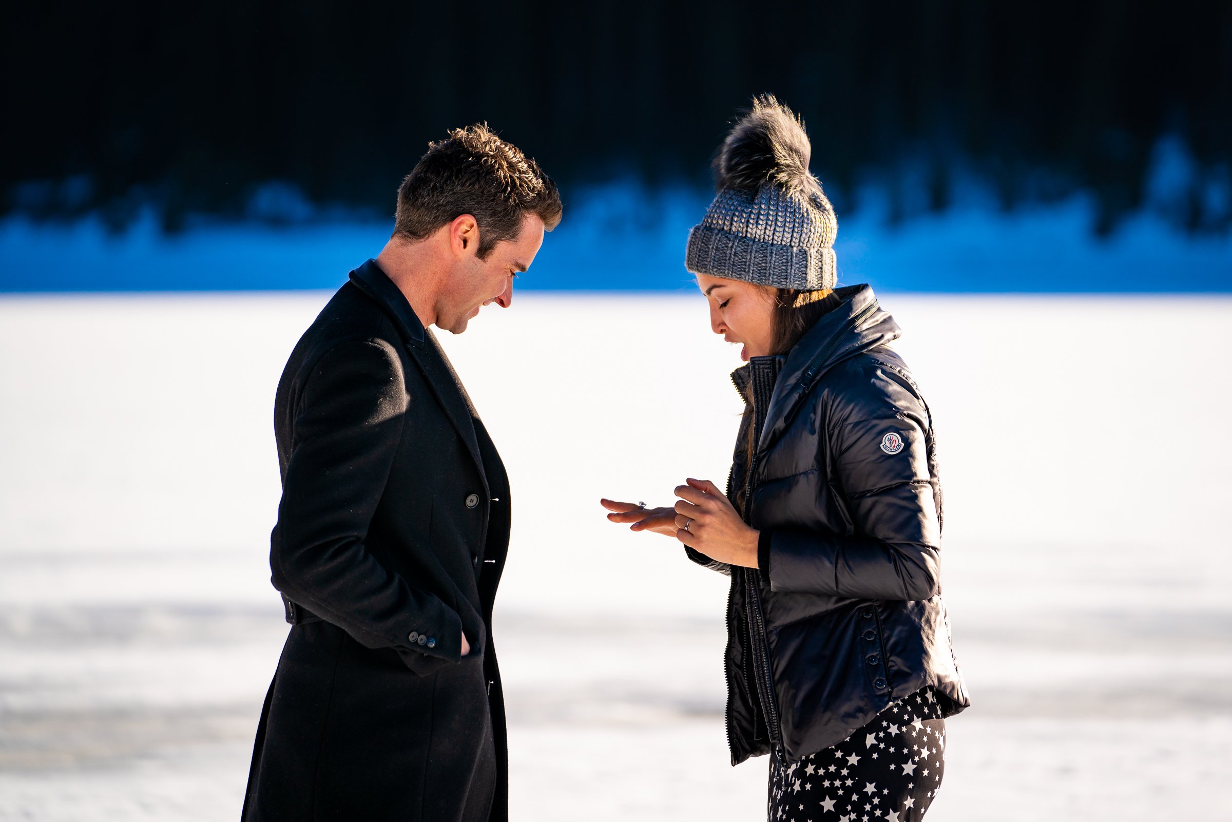 Man proposes to girlfriend while standing on a frozen lake with snowcapped mountains in the background, Engagement Session, Engagement Photos, Engagement Photos Inspiration, Engagement Photography, Engagement Photographer, Winter Engagement Photos, Proposal Photos, Proposal Photographer, Proposal Photography, Winter Proposal, Mountain Proposal, Proposal Inspiration, Summit County engagement session, Summit County engagement photos, Summit County engagement photography, Summit County engagement photographer, Summit County engagement inspiration, Colorado engagement session, Colorado engagement photos, Colorado engagement photography, Colorado engagement photographer, Colorado engagement inspiration, Clinton Gulch Engagement