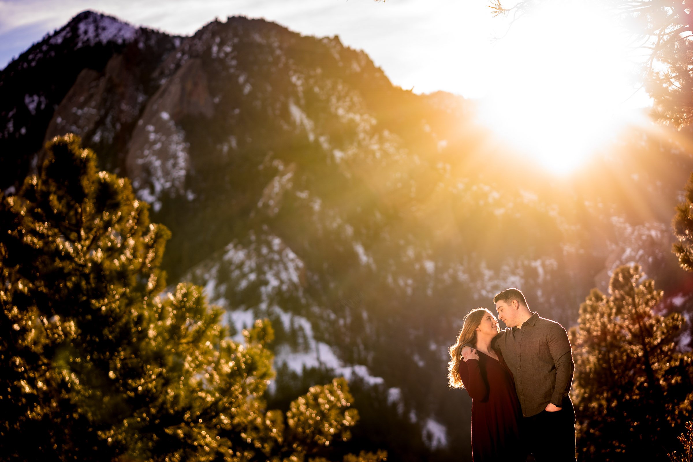 Engaged couple poses for portraits with the flatiron mountains in the background, Mountain Engagement Photos, Engagement Session, Engagement Photos, Engagement Photos Inspiration, Engagement Photography, Engagement Photographer, Engagement Portraits, Winter Engagement Photos, Snow Engagement Photos, Boulder engagement session, Boulder engagement photos, Boulder engagement photography, Boulder engagement photographer, Boulder engagement inspiration, NCAR Trail engagement session, NCAR Trail engagement photos, NCAR Trail engagement photography, NCAR Trail engagement photographer, NCAR Trail engagement inspiration, Colorado engagement session, Colorado engagement photos, Colorado engagement photography, Colorado engagement photographer, Colorado engagement inspiration, Flatiron Engagement Photos, Chautauqua Engagement Photos