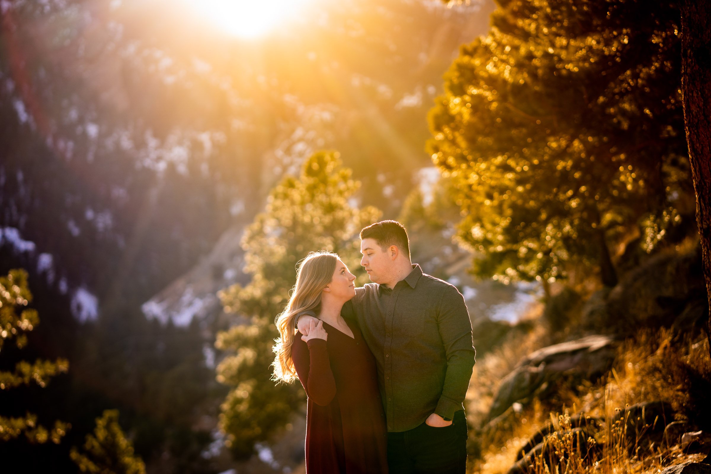 Engaged couple poses for portraits with the flatiron mountains in the background, Mountain Engagement Photos, Engagement Session, Engagement Photos, Engagement Photos Inspiration, Engagement Photography, Engagement Photographer, Engagement Portraits, Winter Engagement Photos, Snow Engagement Photos, Boulder engagement session, Boulder engagement photos, Boulder engagement photography, Boulder engagement photographer, Boulder engagement inspiration, NCAR Trail engagement session, NCAR Trail engagement photos, NCAR Trail engagement photography, NCAR Trail engagement photographer, NCAR Trail engagement inspiration, Colorado engagement session, Colorado engagement photos, Colorado engagement photography, Colorado engagement photographer, Colorado engagement inspiration, Flatiron Engagement Photos, Chautauqua Engagement Photos