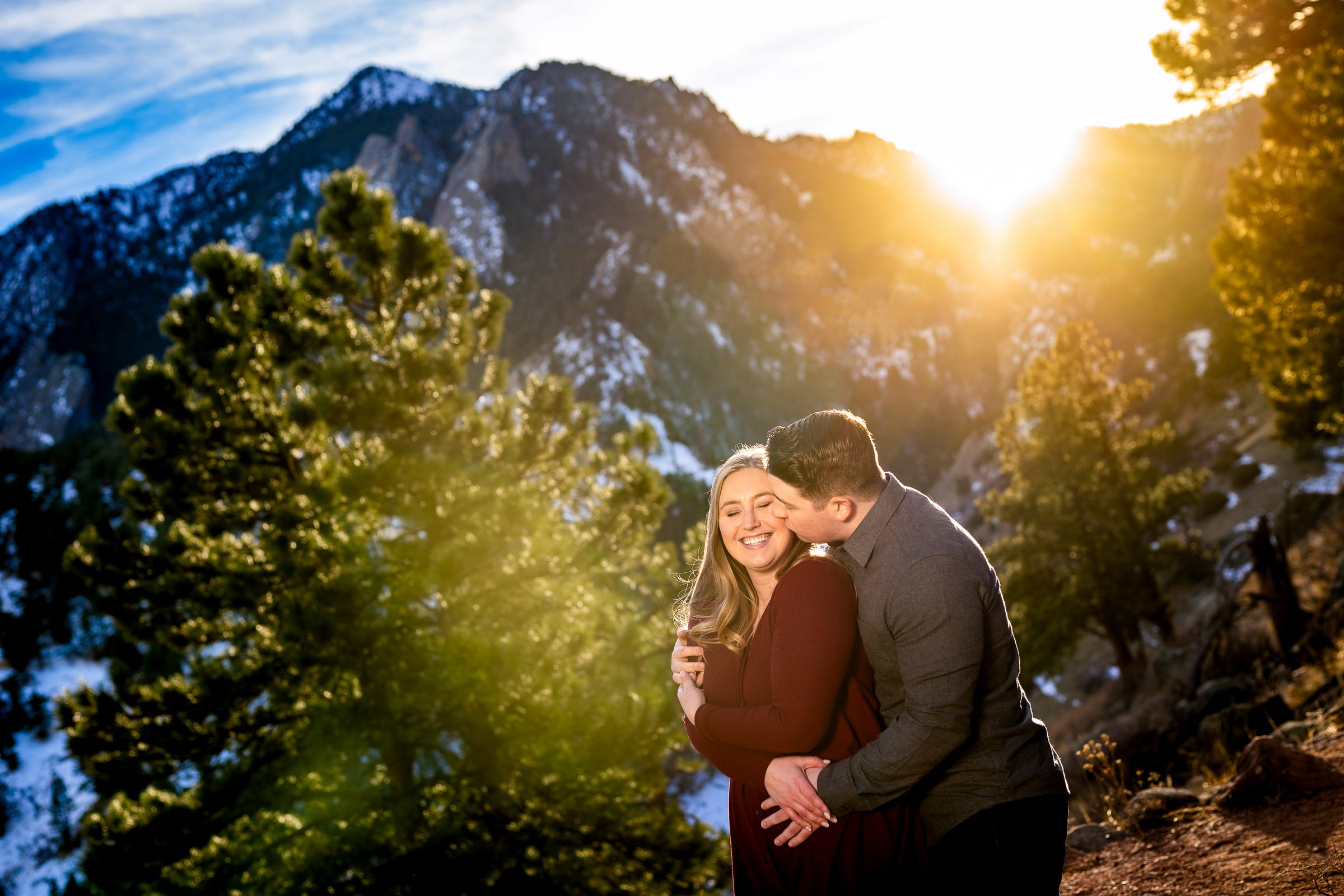 Engaged couple poses for portraits with the flatiron mountains in the background, Mountain Engagement Photos, Engagement Session, Engagement Photos, Engagement Photos Inspiration, Engagement Photography, Engagement Photographer, Engagement Portraits, Winter Engagement Photos, Snow Engagement Photos, Boulder engagement session, Boulder engagement photos, Boulder engagement photography, Boulder engagement photographer, Boulder engagement inspiration, NCAR Trail engagement session, NCAR Trail engagement photos, NCAR Trail engagement photography, NCAR Trail engagement photographer, NCAR Trail engagement inspiration, Colorado engagement session, Colorado engagement photos, Colorado engagement photography, Colorado engagement photographer, Colorado engagement inspiration, Flatiron Engagement Photos, Chautauqua Engagement Photos