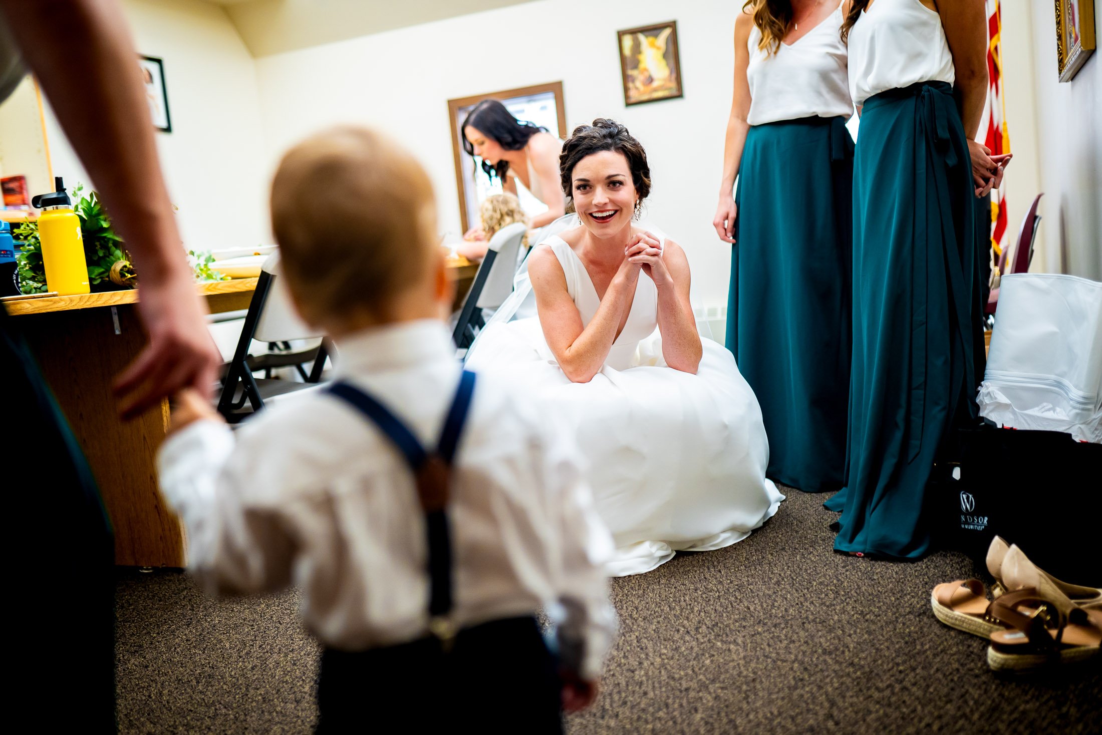 Bride greets her nephew, wedding, wedding photos, wedding photography, wedding photographer, wedding inspiration, wedding photo inspiration, wedding portraits, wedding ceremony, wedding reception, mountain wedding, Catholic Church wedding, Catholic Church wedding photos, Catholic Church wedding photography, Catholic Church wedding photographer, Catholic Church wedding inspiration, Catholic Church wedding venue, Steamboat Springs wedding, Steamboat Springs wedding photos, Steamboat Springs wedding photography, Steamboat Springs wedding photographer, Colorado wedding, Colorado wedding photos, Colorado wedding photography, Colorado wedding photographer, Colorado mountain wedding, Colorado wedding inspiration