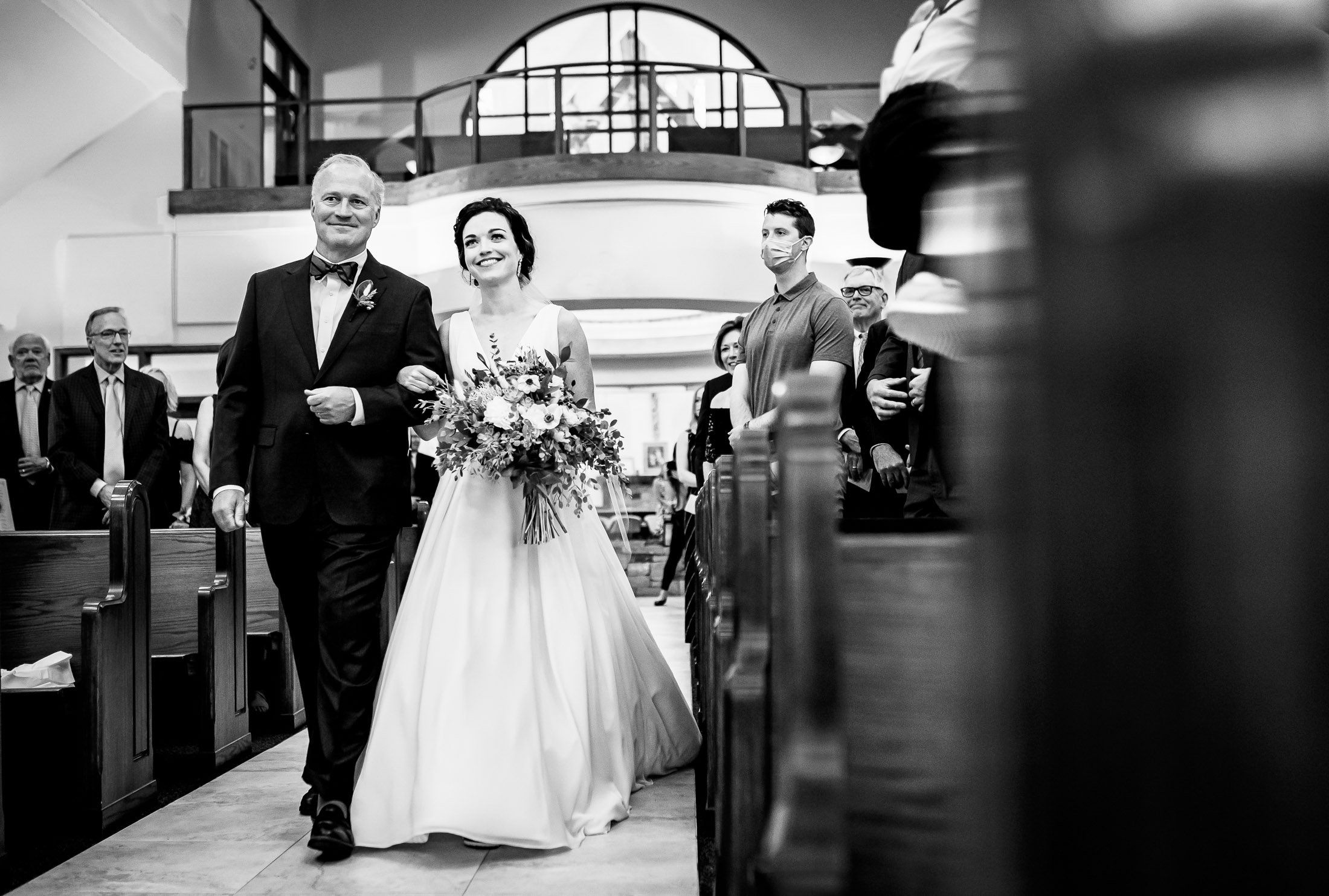 Bride walks down the aisle during the processional during their wedding ceremony at the church, wedding, wedding photos, wedding photography, wedding photographer, wedding inspiration, wedding photo inspiration, wedding portraits, wedding ceremony, wedding reception, mountain wedding, Catholic Church wedding, Catholic Church wedding photos, Catholic Church wedding photography, Catholic Church wedding photographer, Catholic Church wedding inspiration, Catholic Church wedding venue, Steamboat Springs wedding, Steamboat Springs wedding photos, Steamboat Springs wedding photography, Steamboat Springs wedding photographer, Colorado wedding, Colorado wedding photos, Colorado wedding photography, Colorado wedding photographer, Colorado mountain wedding, Colorado wedding inspiration