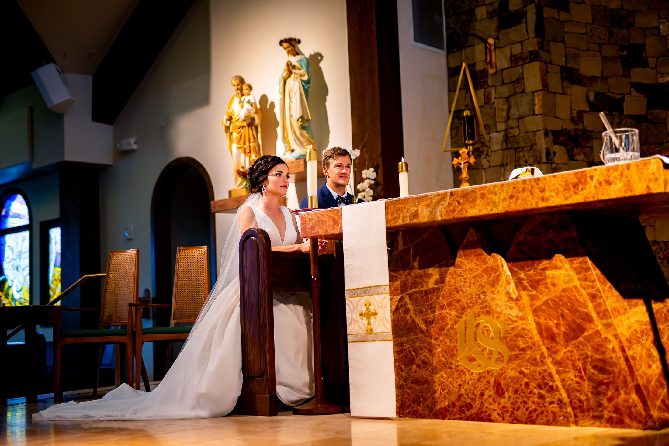 Bride and groom attend their catholic wedding ceremony at the church, wedding, wedding photos, wedding photography, wedding photographer, wedding inspiration, wedding photo inspiration, wedding portraits, wedding ceremony, wedding reception, mountain wedding, Catholic Church wedding, Catholic Church wedding photos, Catholic Church wedding photography, Catholic Church wedding photographer, Catholic Church wedding inspiration, Catholic Church wedding venue, Steamboat Springs wedding, Steamboat Springs wedding photos, Steamboat Springs wedding photography, Steamboat Springs wedding photographer, Colorado wedding, Colorado wedding photos, Colorado wedding photography, Colorado wedding photographer, Colorado mountain wedding, Colorado wedding inspiration