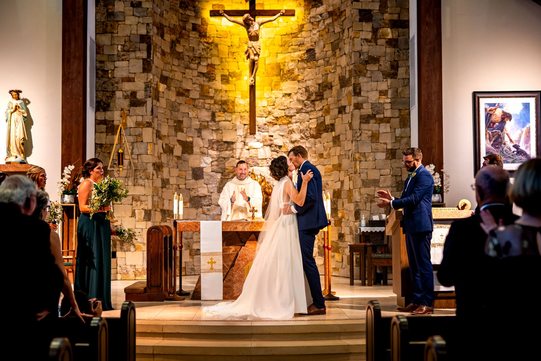 Bride and groom share their first kiss during their catholic wedding ceremony at the church, wedding, wedding photos, wedding photography, wedding photographer, wedding inspiration, wedding photo inspiration, wedding portraits, wedding ceremony, wedding reception, mountain wedding, Catholic Church wedding, Catholic Church wedding photos, Catholic Church wedding photography, Catholic Church wedding photographer, Catholic Church wedding inspiration, Catholic Church wedding venue, Steamboat Springs wedding, Steamboat Springs wedding photos, Steamboat Springs wedding photography, Steamboat Springs wedding photographer, Colorado wedding, Colorado wedding photos, Colorado wedding photography, Colorado wedding photographer, Colorado mountain wedding, Colorado wedding inspiration