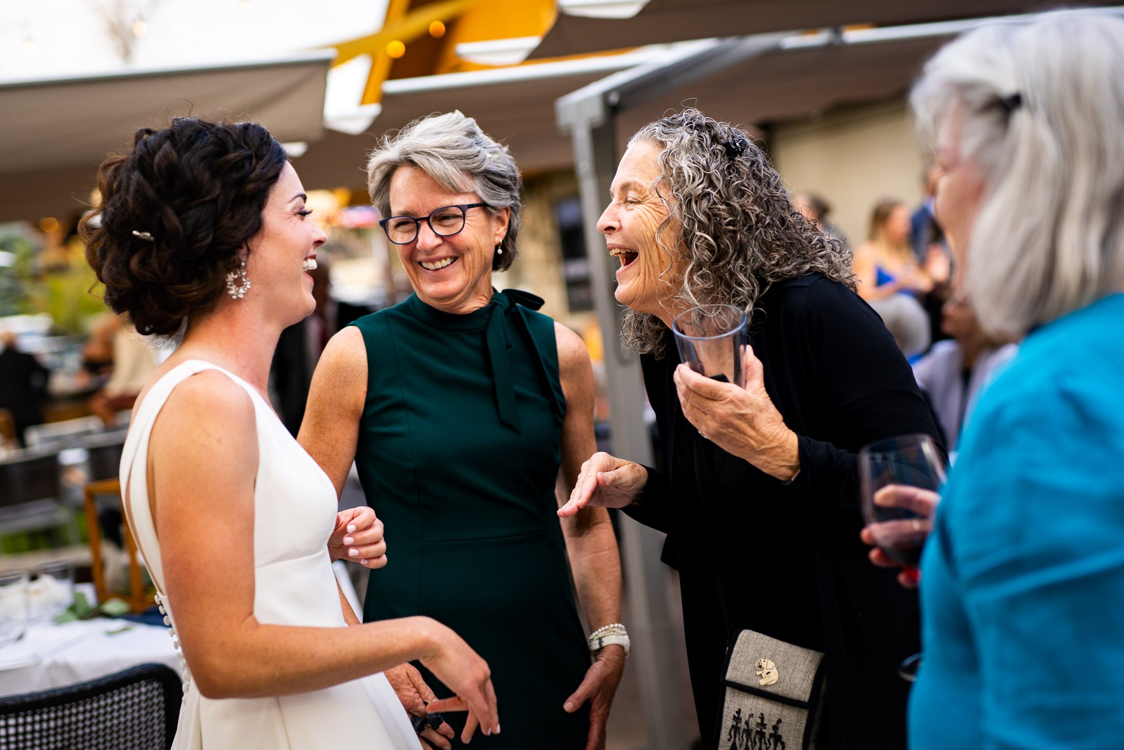 Bride and groom mingle with guests during their wedding reception, wedding, wedding photos, wedding photography, wedding photographer, wedding inspiration, wedding photo inspiration, wedding portraits, wedding ceremony, wedding reception, mountain wedding, Catholic Church wedding, Catholic Church wedding photos, Catholic Church wedding photography, Catholic Church wedding photographer, Catholic Church wedding inspiration, Catholic Church wedding venue, Steamboat Springs wedding, Steamboat Springs wedding photos, Steamboat Springs wedding photography, Steamboat Springs wedding photographer, Colorado wedding, Colorado wedding photos, Colorado wedding photography, Colorado wedding photographer, Colorado mountain wedding, Colorado wedding inspiration