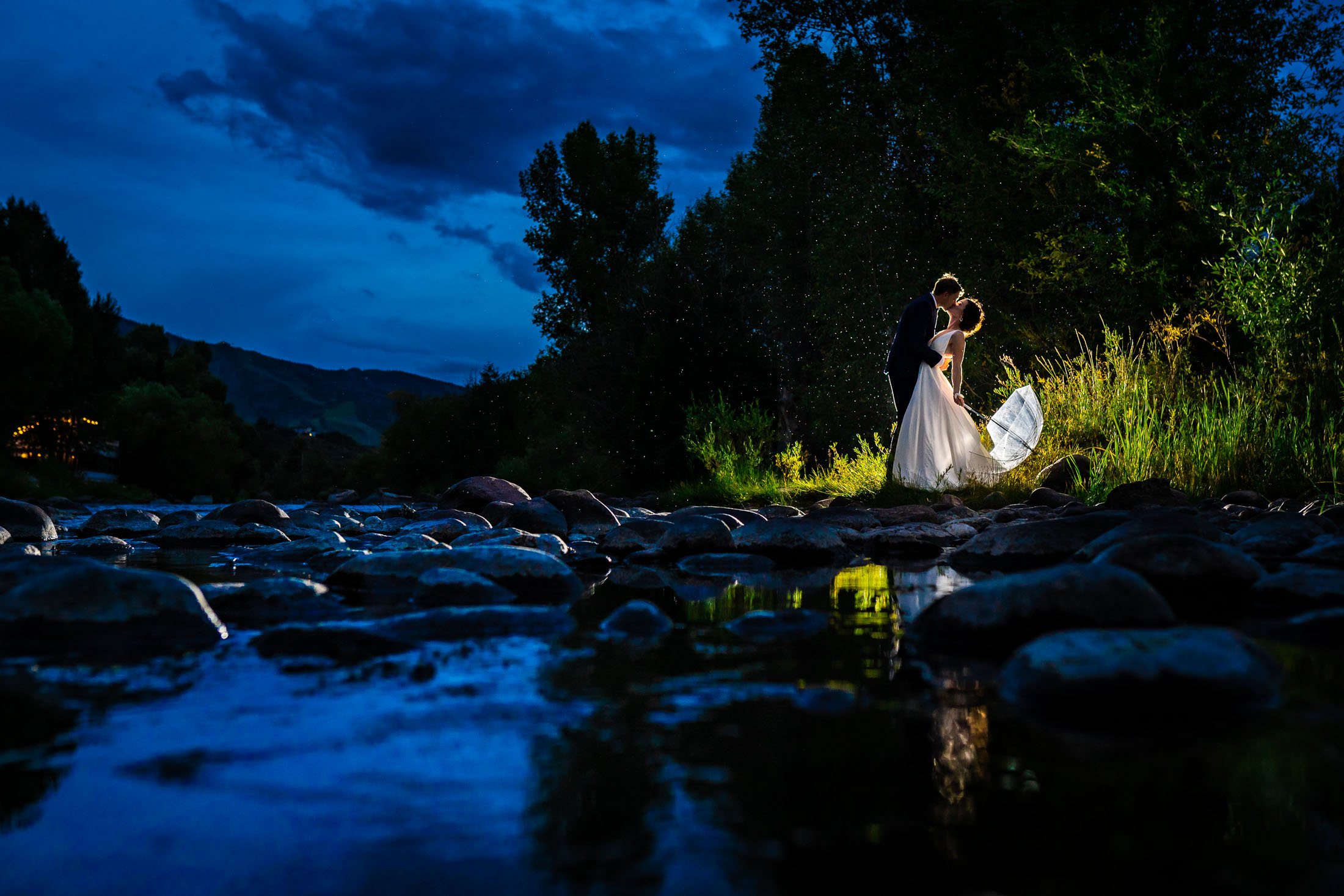 Bride and groom share their first dance on the outdoor patio under cafe lights at blue hour during their wedding reception, wedding, wedding photos, wedding photography, wedding photographer, wedding inspiration, wedding photo inspiration, wedding portraits, wedding ceremony, wedding reception, mountain wedding, Catholic Church wedding, Catholic Church wedding photos, Catholic Church wedding photography, Catholic Church wedding photographer, Catholic Church wedding inspiration, Catholic Church wedding venue, Steamboat Springs wedding, Steamboat Springs wedding photos, Steamboat Springs wedding photography, Steamboat Springs wedding photographer, Colorado wedding, Colorado wedding photos, Colorado wedding photography, Colorado wedding photographer, Colorado mountain wedding, Colorado wedding inspiration