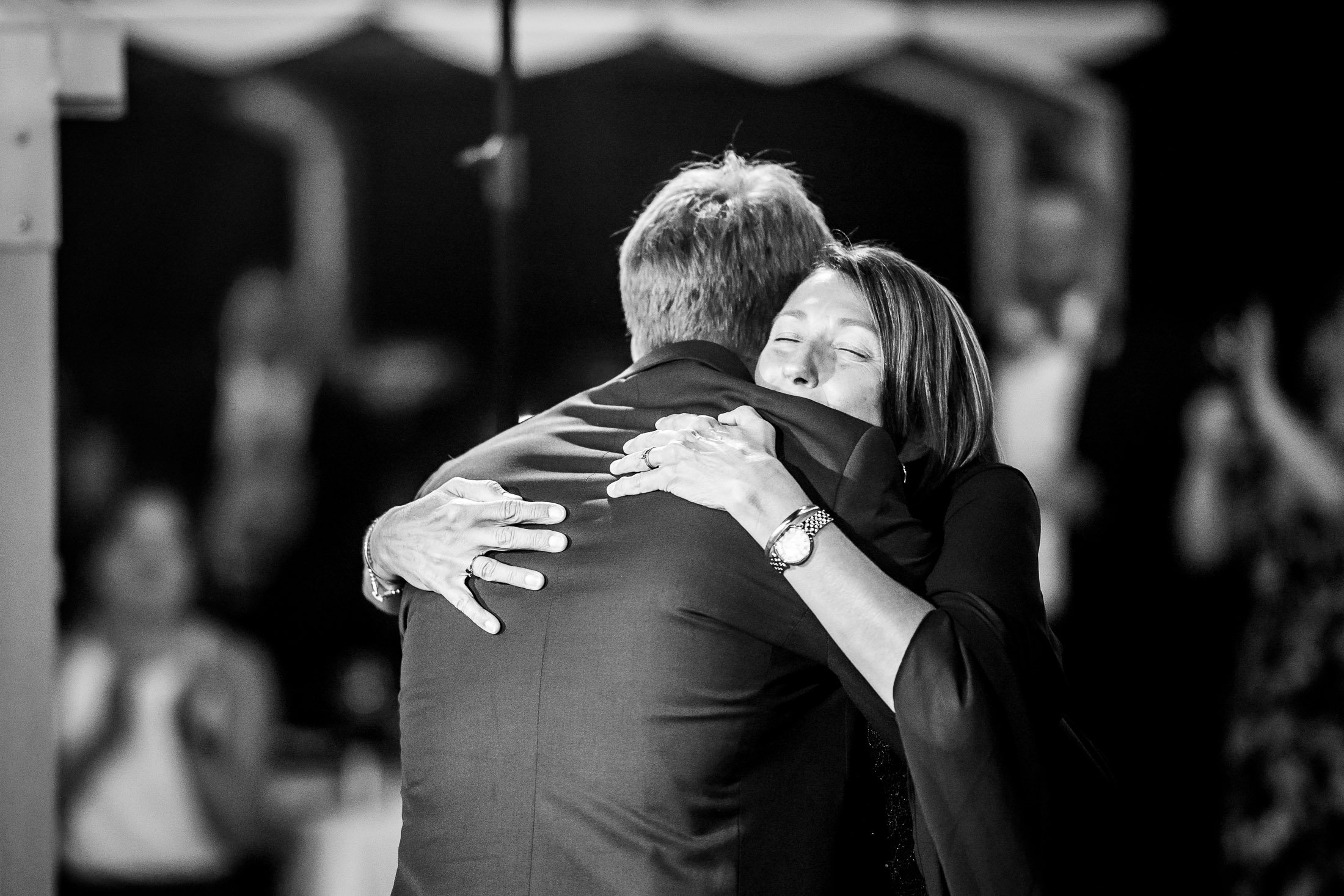 Groom shares a first dance with his mother on the outdoor patio under cafe lights at blue hour during their wedding reception, wedding, wedding photos, wedding photography, wedding photographer, wedding inspiration, wedding photo inspiration, wedding portraits, wedding ceremony, wedding reception, mountain wedding, Catholic Church wedding, Catholic Church wedding photos, Catholic Church wedding photography, Catholic Church wedding photographer, Catholic Church wedding inspiration, Catholic Church wedding venue, Steamboat Springs wedding, Steamboat Springs wedding photos, Steamboat Springs wedding photography, Steamboat Springs wedding photographer, Colorado wedding, Colorado wedding photos, Colorado wedding photography, Colorado wedding photographer, Colorado mountain wedding, Colorado wedding inspiration