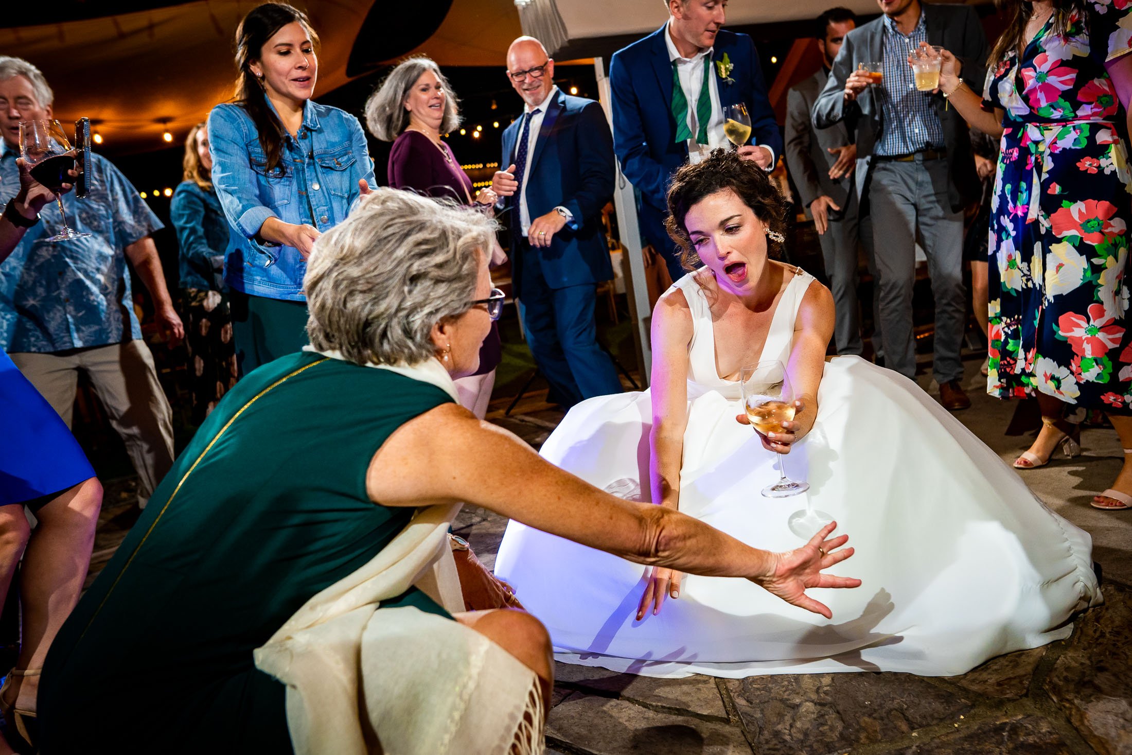 Guests dance to music on the outdoor patio under cafe lights during the wedding reception, wedding, wedding photos, wedding photography, wedding photographer, wedding inspiration, wedding photo inspiration, wedding portraits, wedding ceremony, wedding reception, mountain wedding, Catholic Church wedding, Catholic Church wedding photos, Catholic Church wedding photography, Catholic Church wedding photographer, Catholic Church wedding inspiration, Catholic Church wedding venue, Steamboat Springs wedding, Steamboat Springs wedding photos, Steamboat Springs wedding photography, Steamboat Springs wedding photographer, Colorado wedding, Colorado wedding photos, Colorado wedding photography, Colorado wedding photographer, Colorado mountain wedding, Colorado wedding inspiration