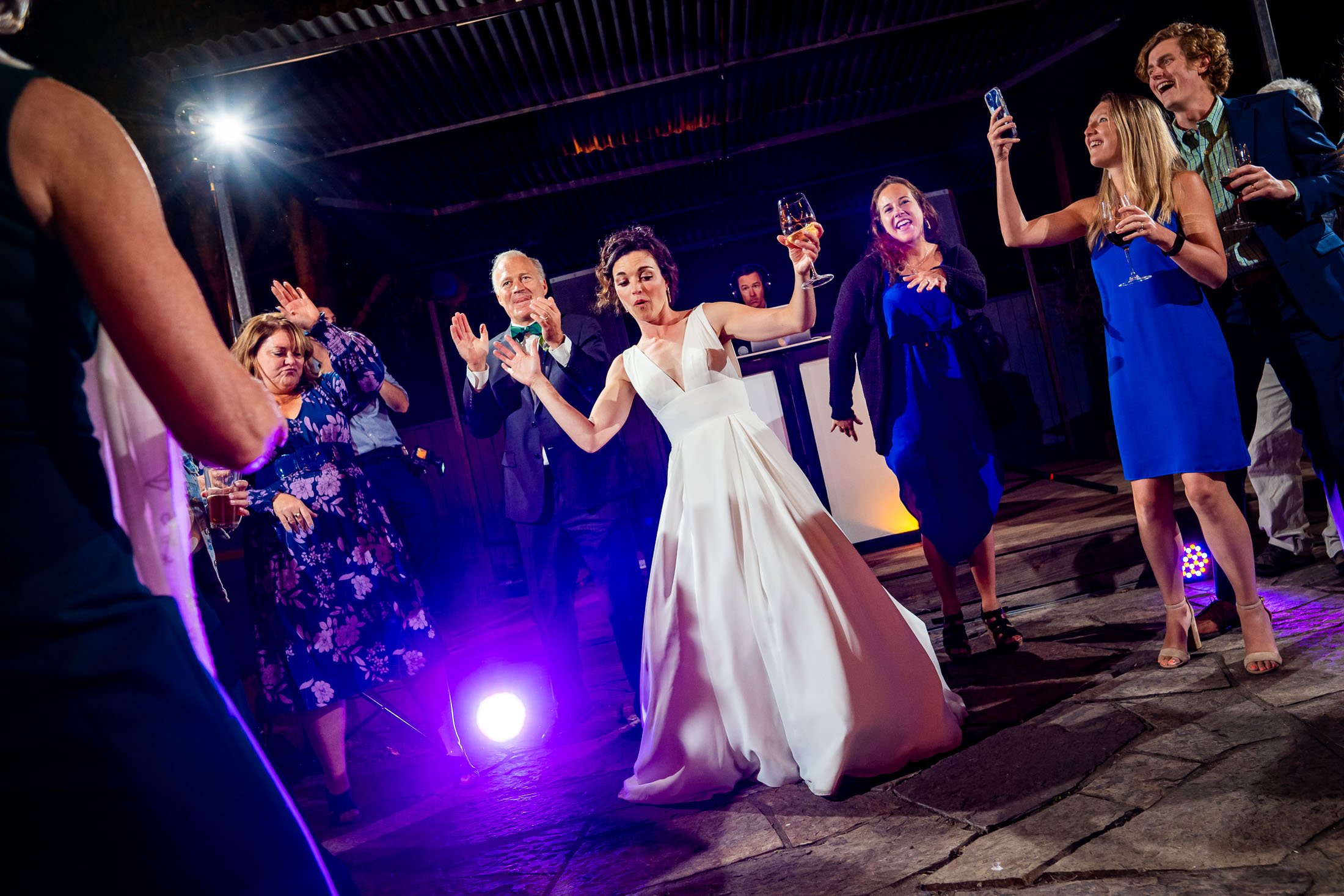 Guests dance to music on the outdoor patio under cafe lights during the wedding reception, wedding, wedding photos, wedding photography, wedding photographer, wedding inspiration, wedding photo inspiration, wedding portraits, wedding ceremony, wedding reception, mountain wedding, Catholic Church wedding, Catholic Church wedding photos, Catholic Church wedding photography, Catholic Church wedding photographer, Catholic Church wedding inspiration, Catholic Church wedding venue, Steamboat Springs wedding, Steamboat Springs wedding photos, Steamboat Springs wedding photography, Steamboat Springs wedding photographer, Colorado wedding, Colorado wedding photos, Colorado wedding photography, Colorado wedding photographer, Colorado mountain wedding, Colorado wedding inspiration